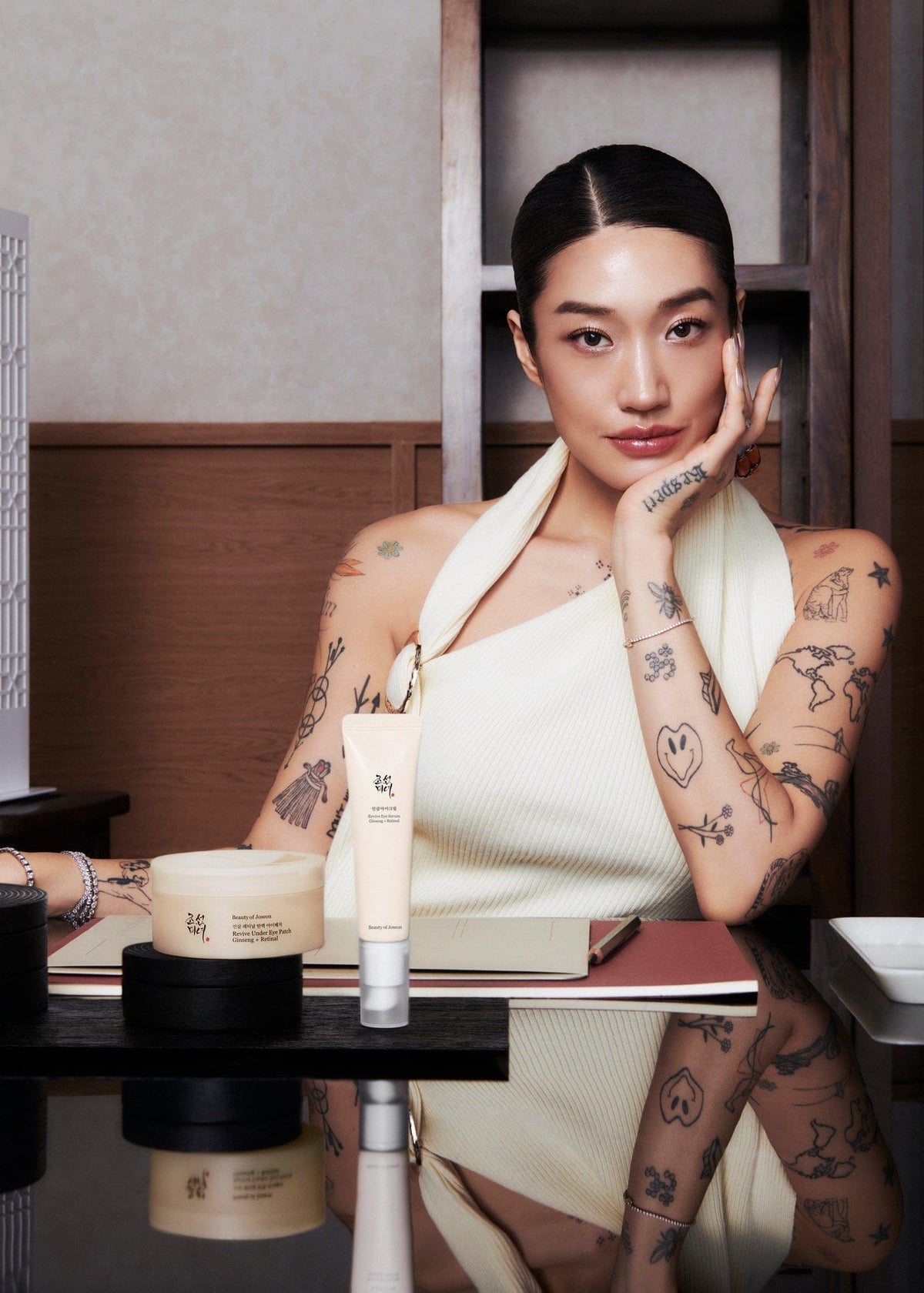 a woman with tattoos on her hands