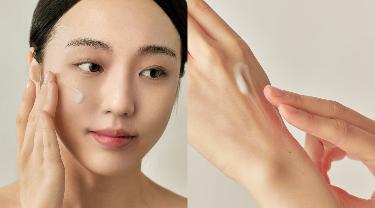 a woman applying cream on her hand