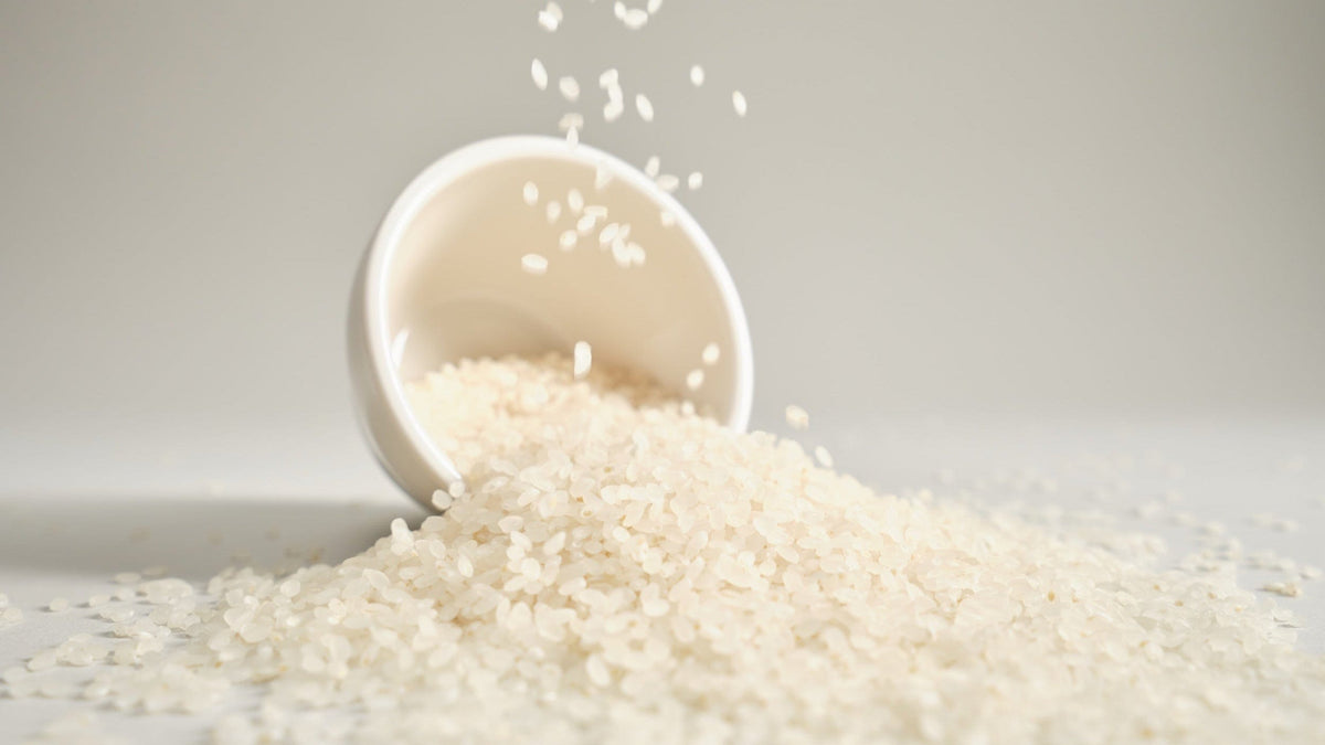 a bowl of rice spilling out of it
