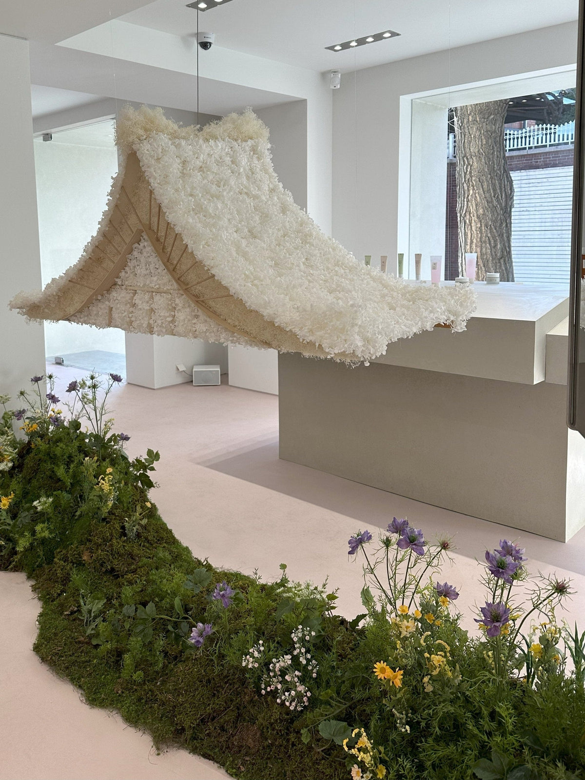 a white object with a white structure and flowers