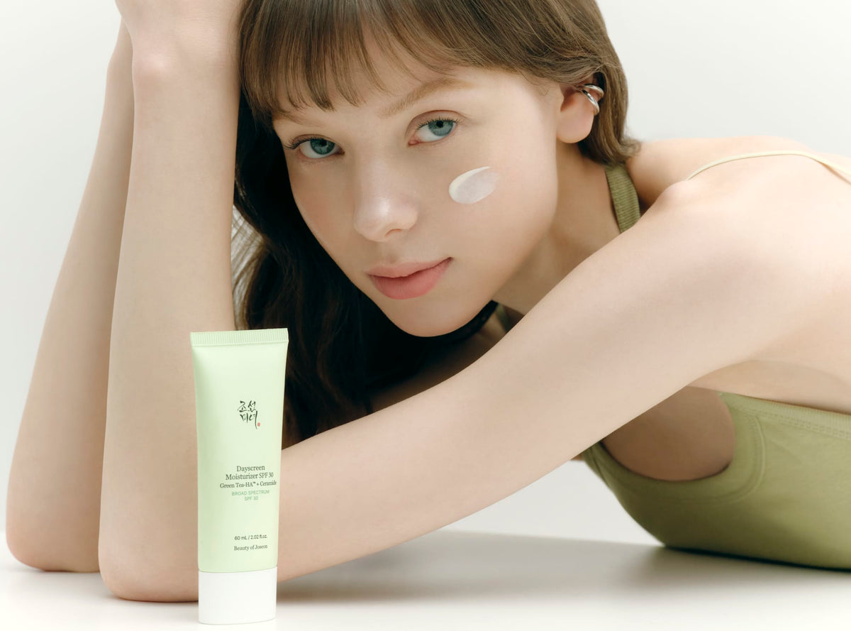 a woman with a cream on her face