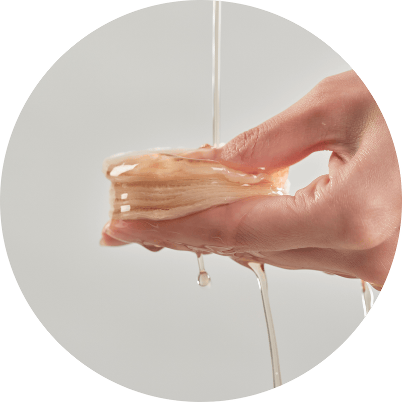 a hand holding a piece of food