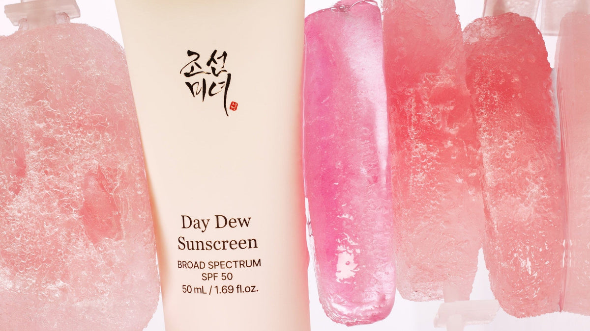 a cream tube with a label next to a group of pink popsicle