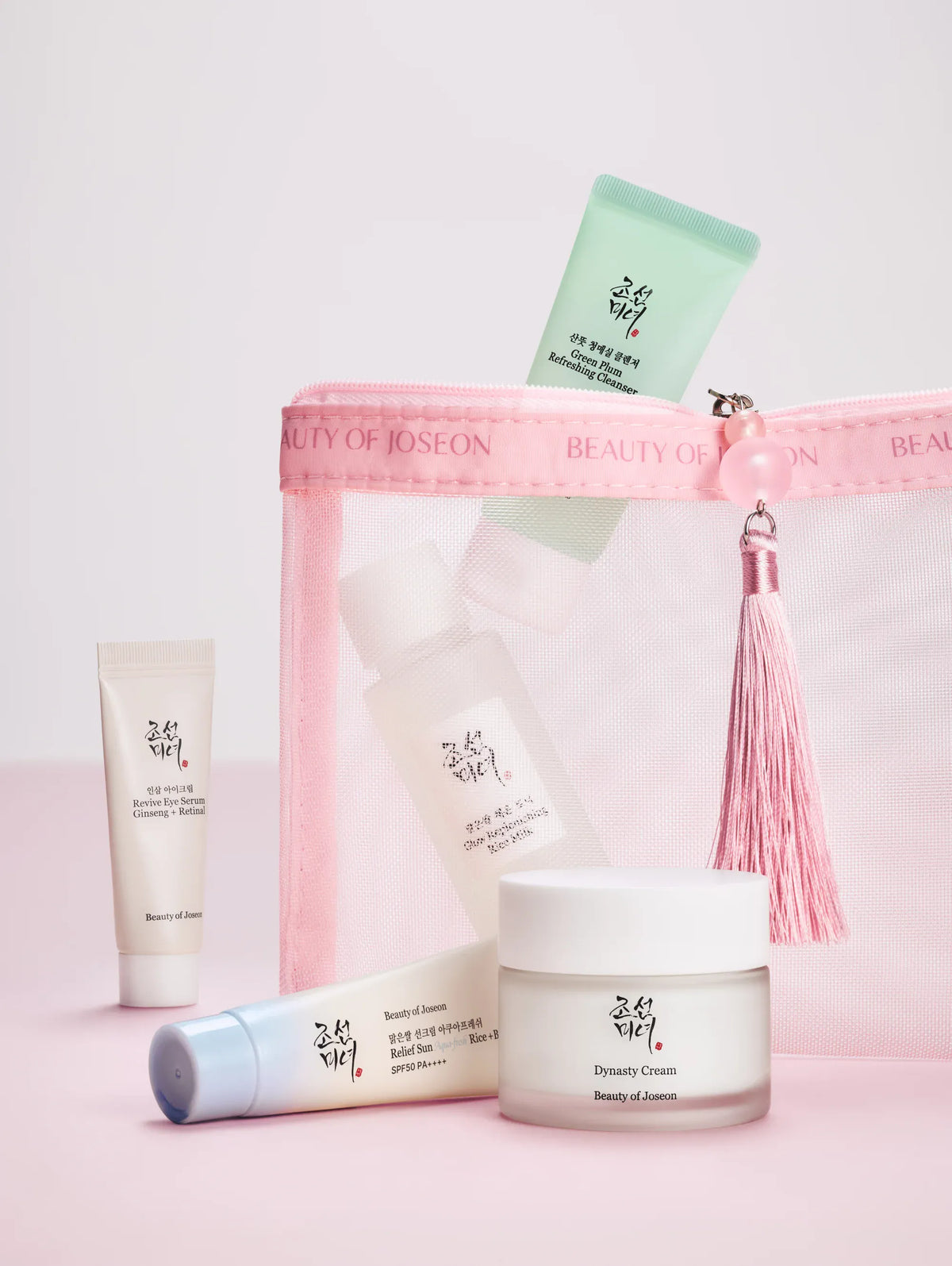 a group of small bottles of cosmetics
