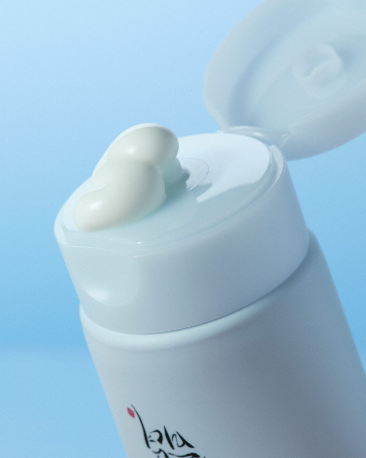 a white bottle of cream