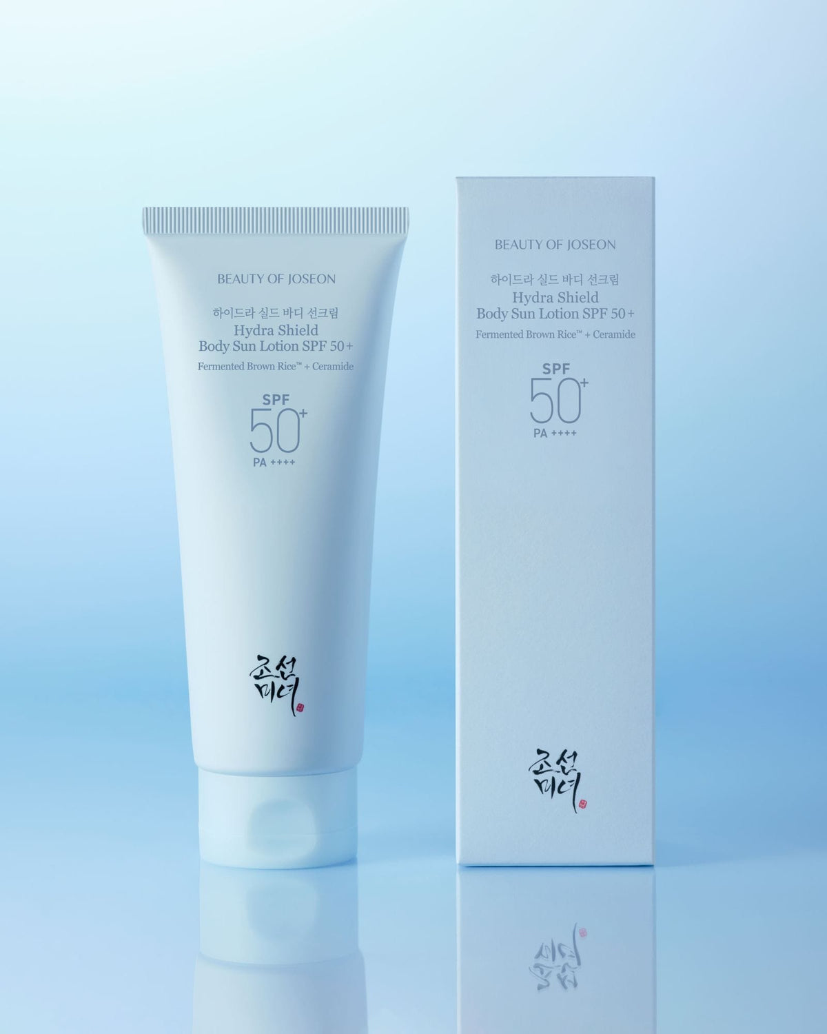 a white tube of cream next to a box