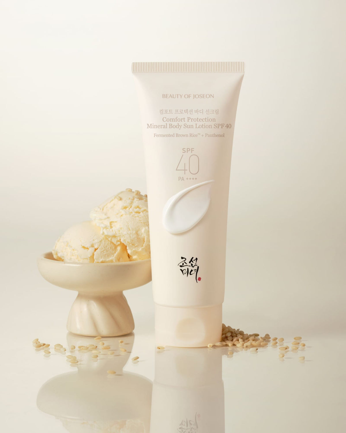 a cream bottle next to a bowl of ice cream