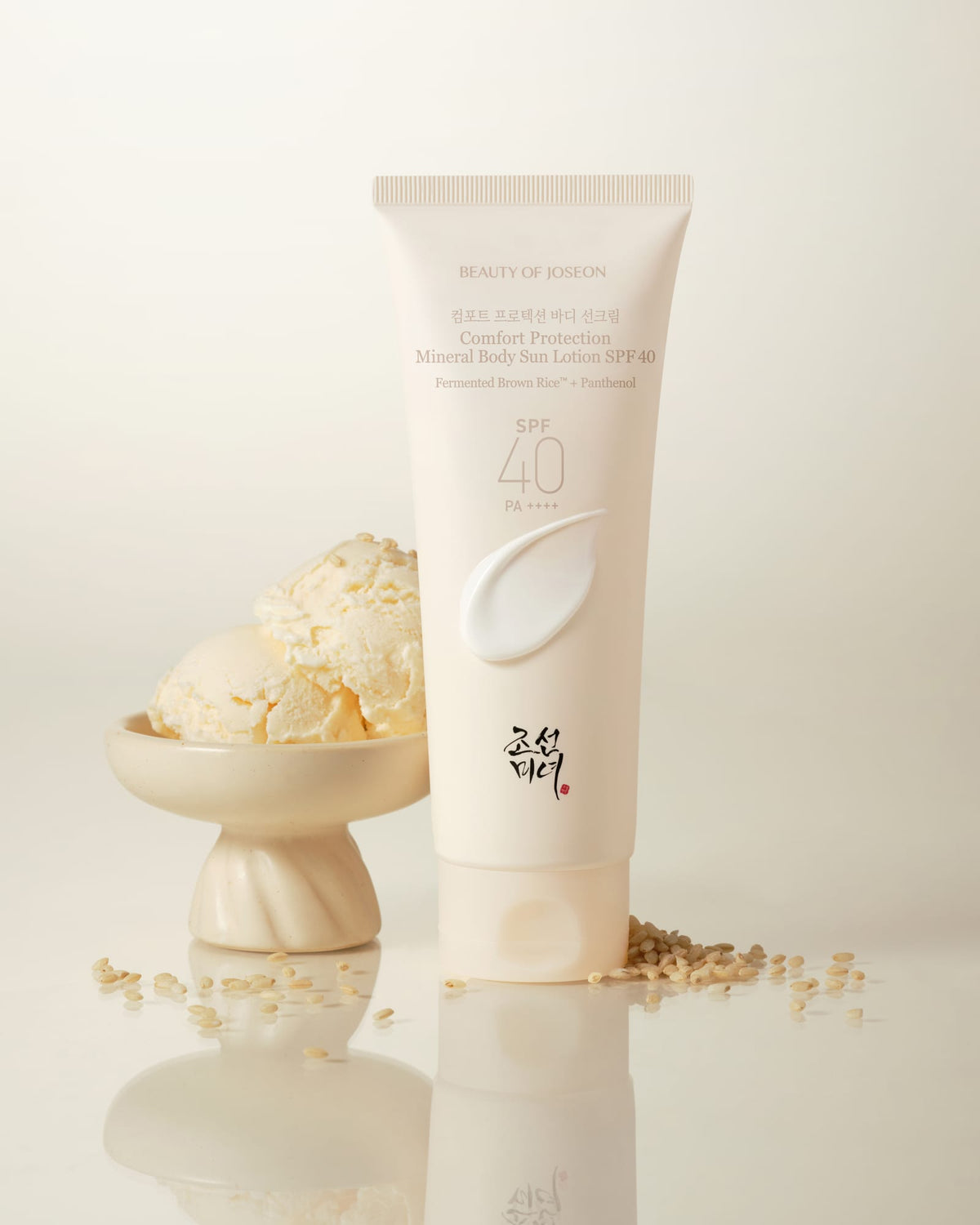 a cream bottle next to a bowl of ice cream