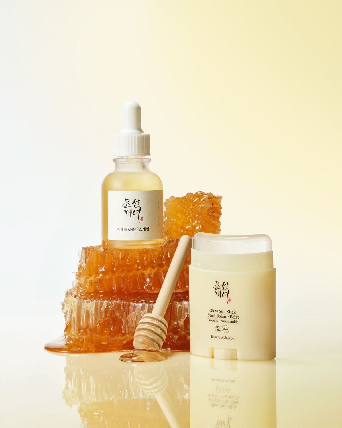 a honeycomb with honey and a bottle of honey