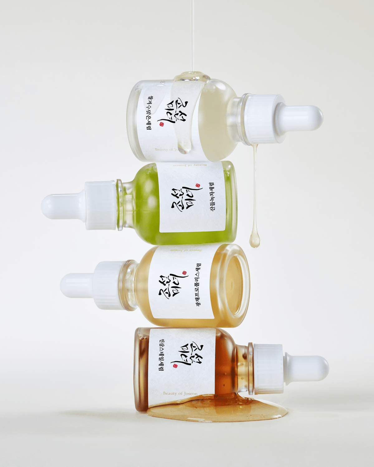 a group of small bottles with white caps