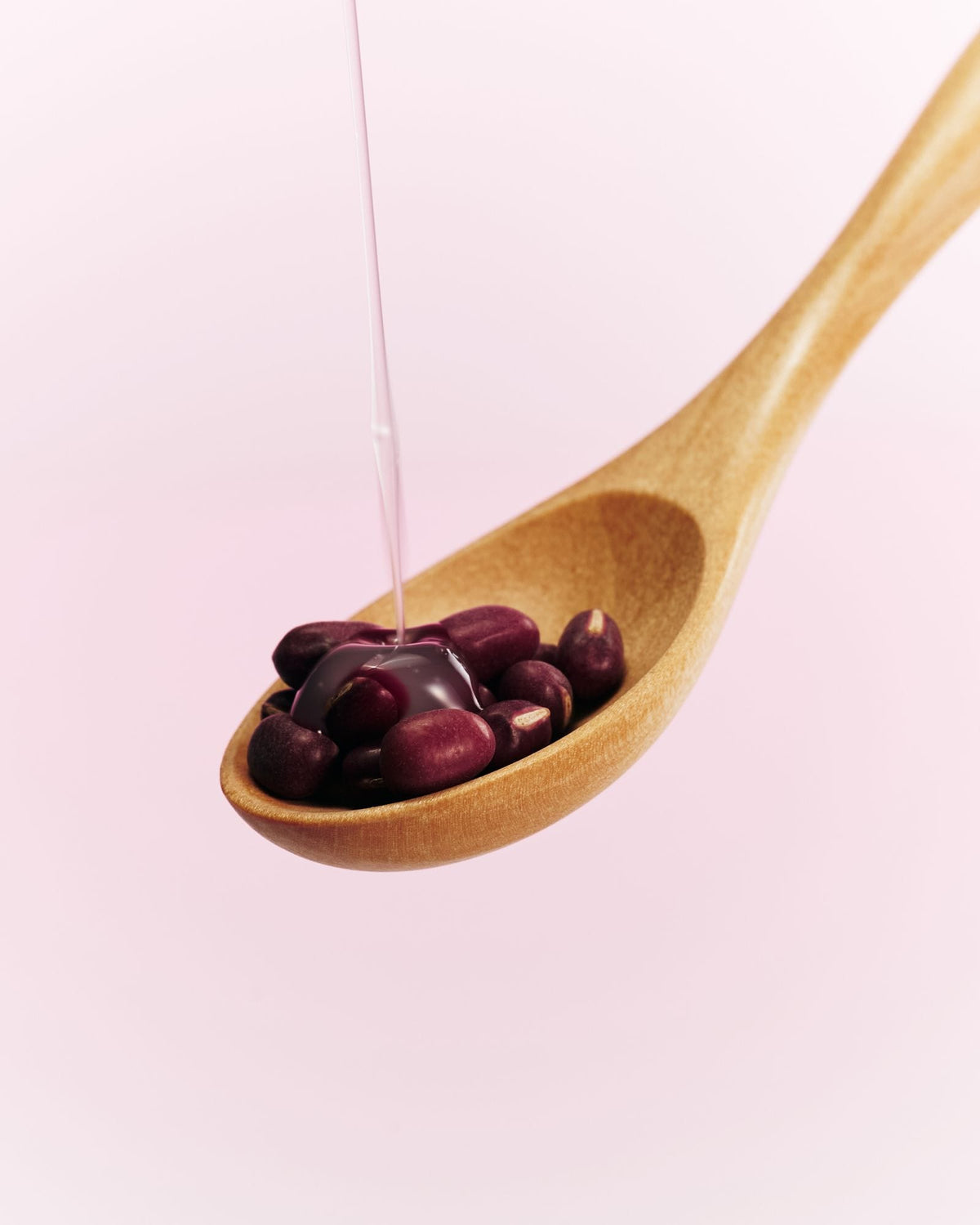 a spoon full of beans and liquid