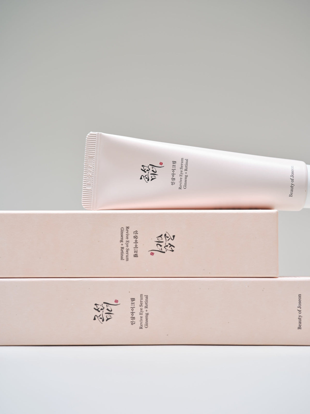 a tube of cream on top of a stack of boxes
