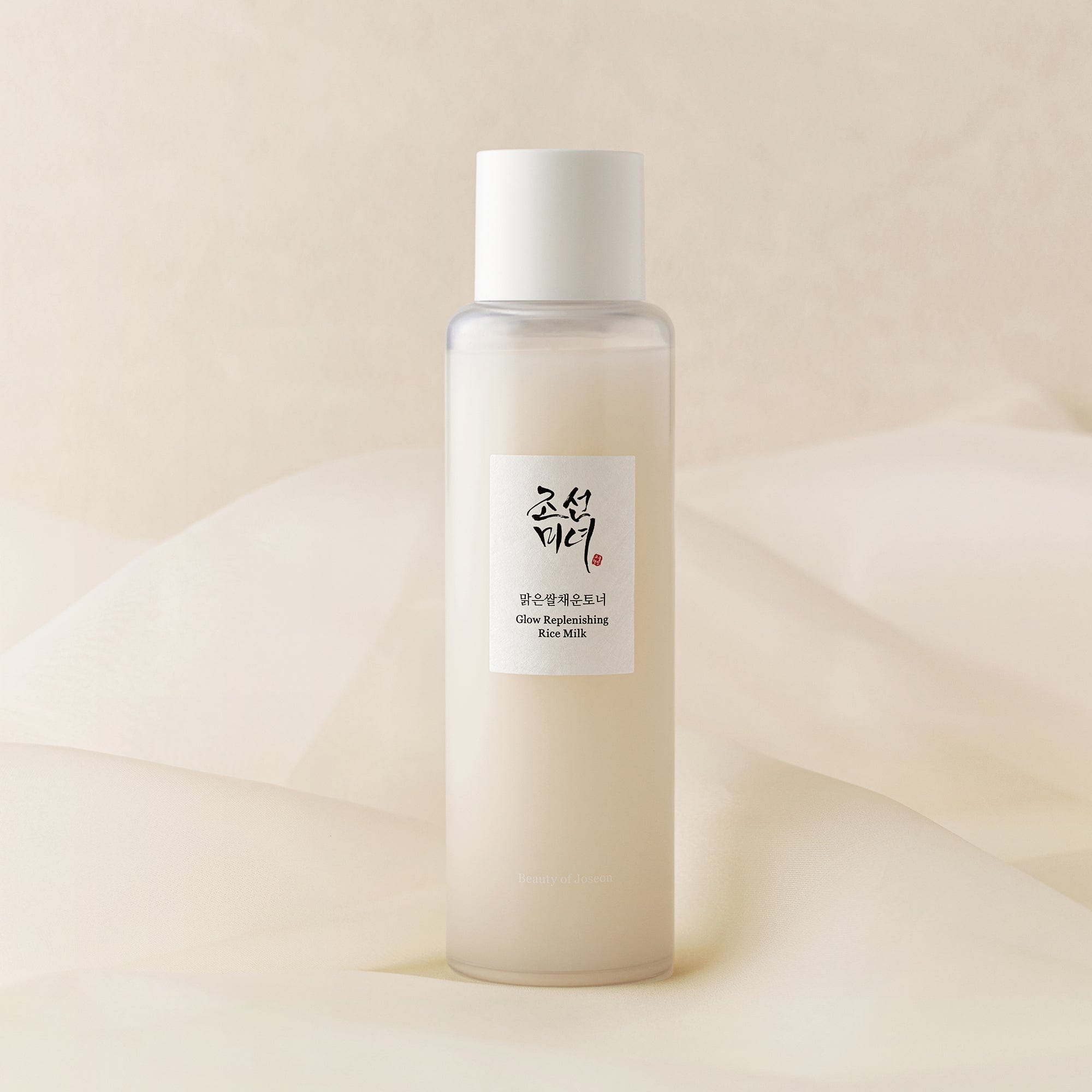 a bottle of shampoo on a white fabric