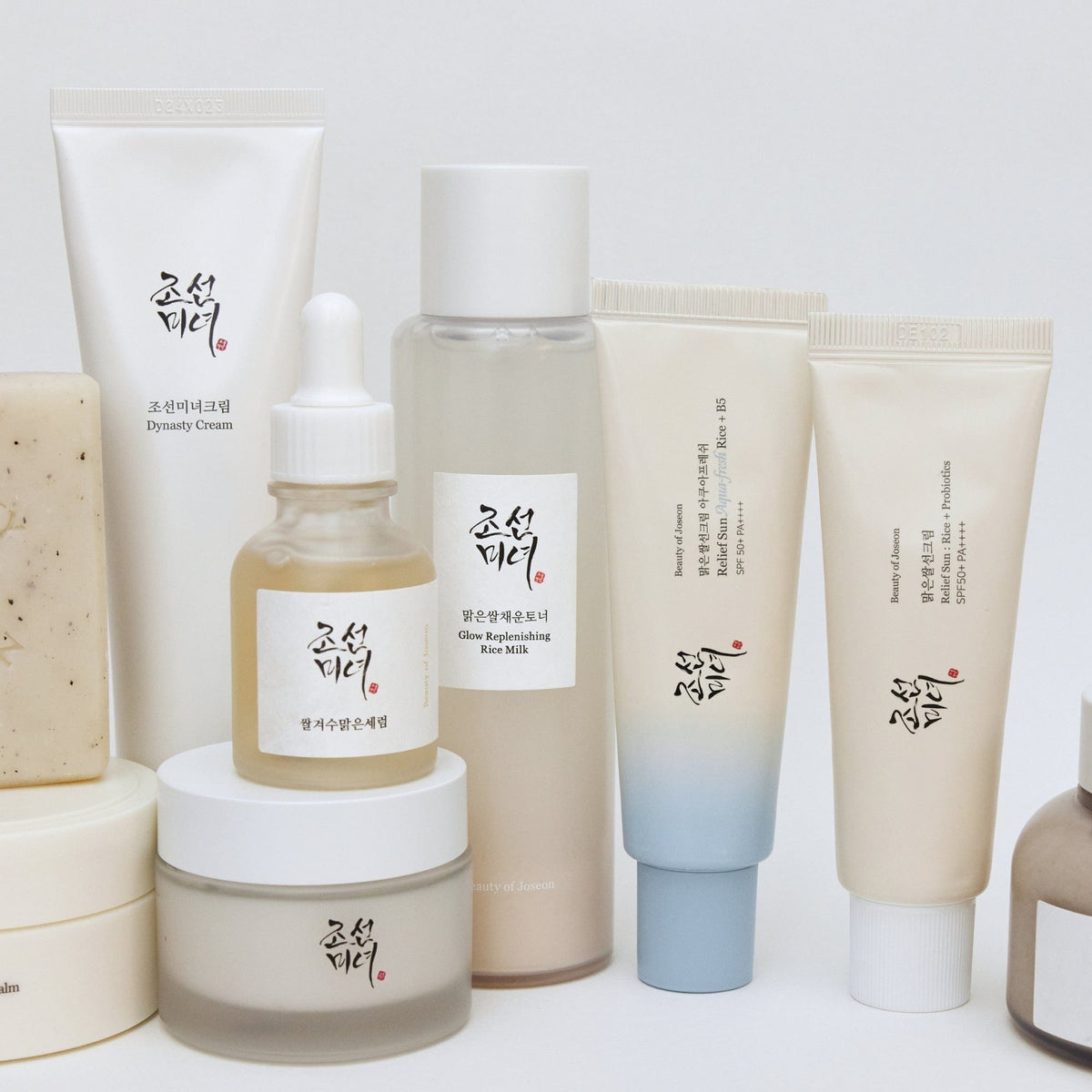 a group of different containers of cosmetics