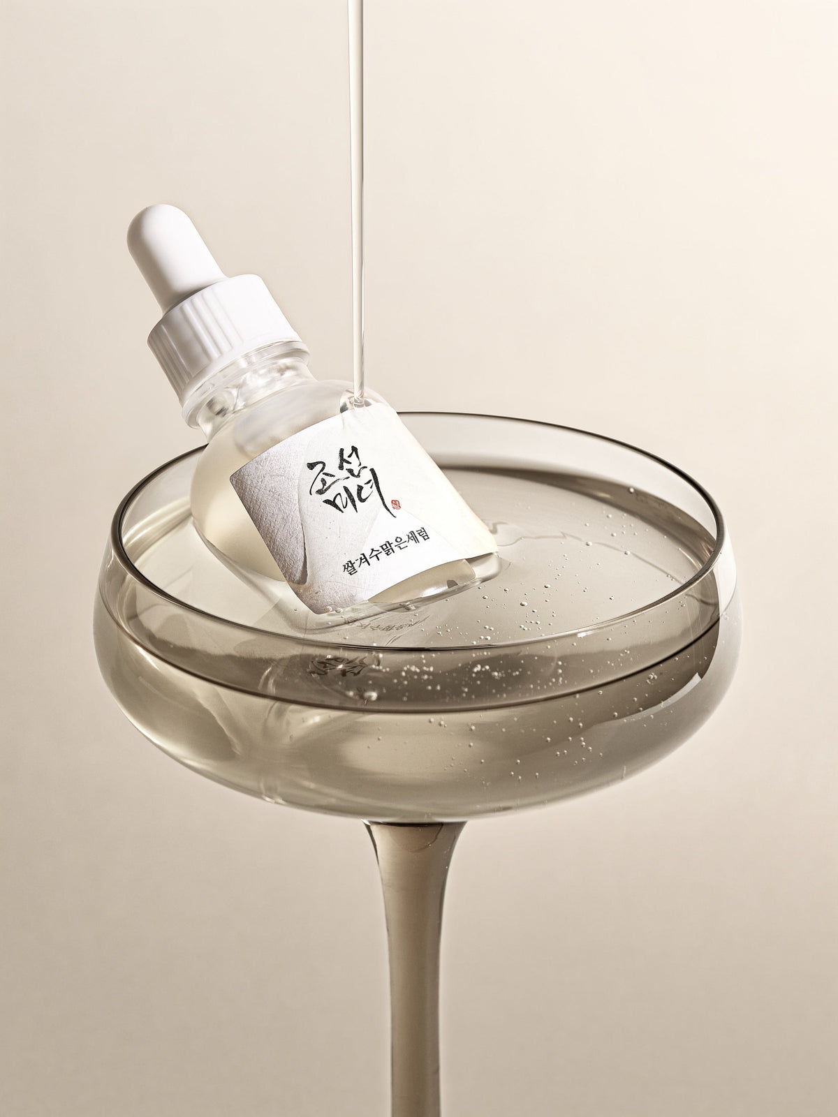 a bottle in a glass of liquid