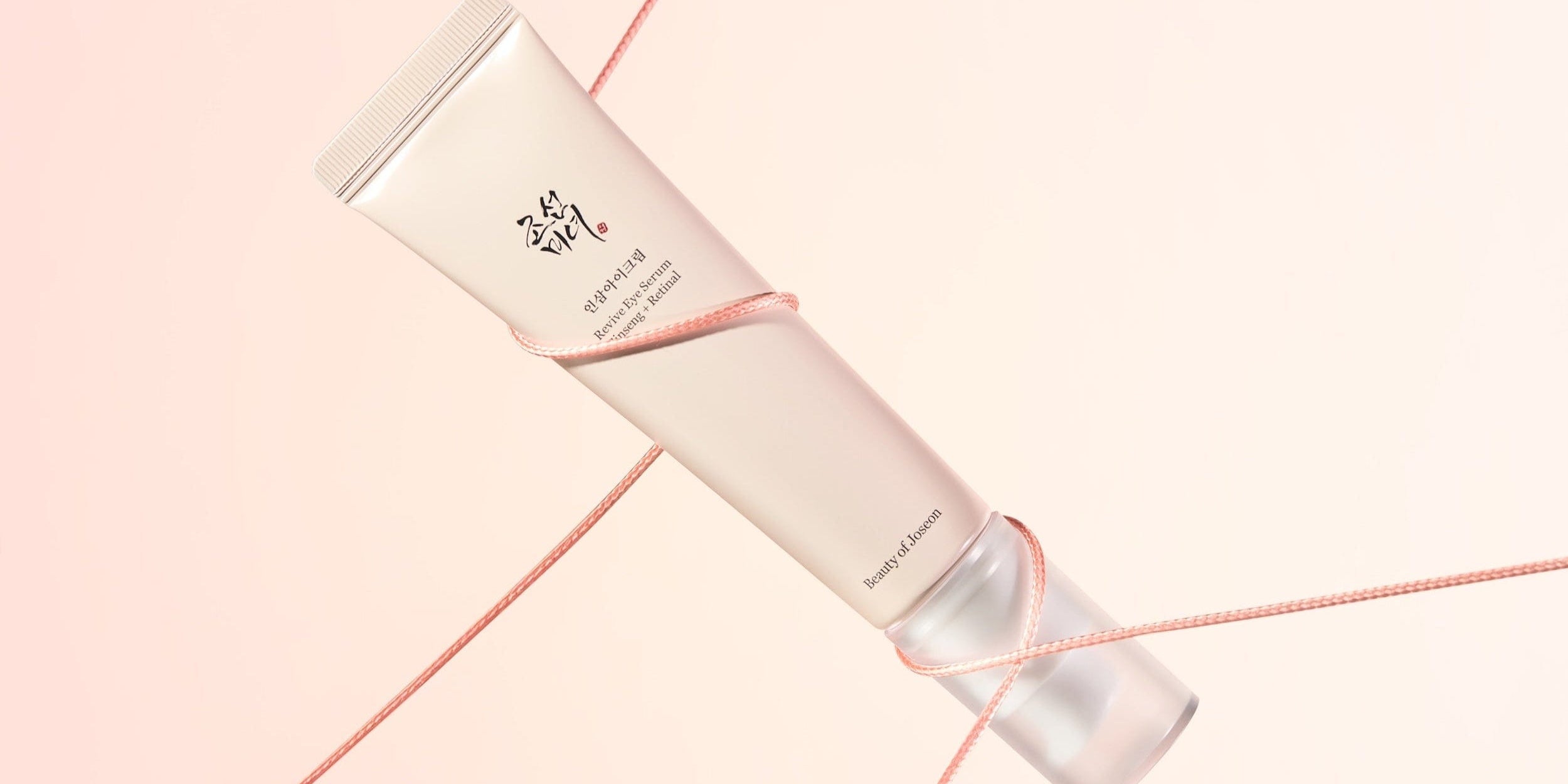 a tube of cream tied with a rope
