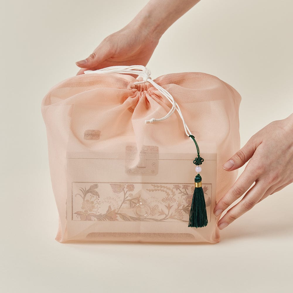 a hand holding a bag