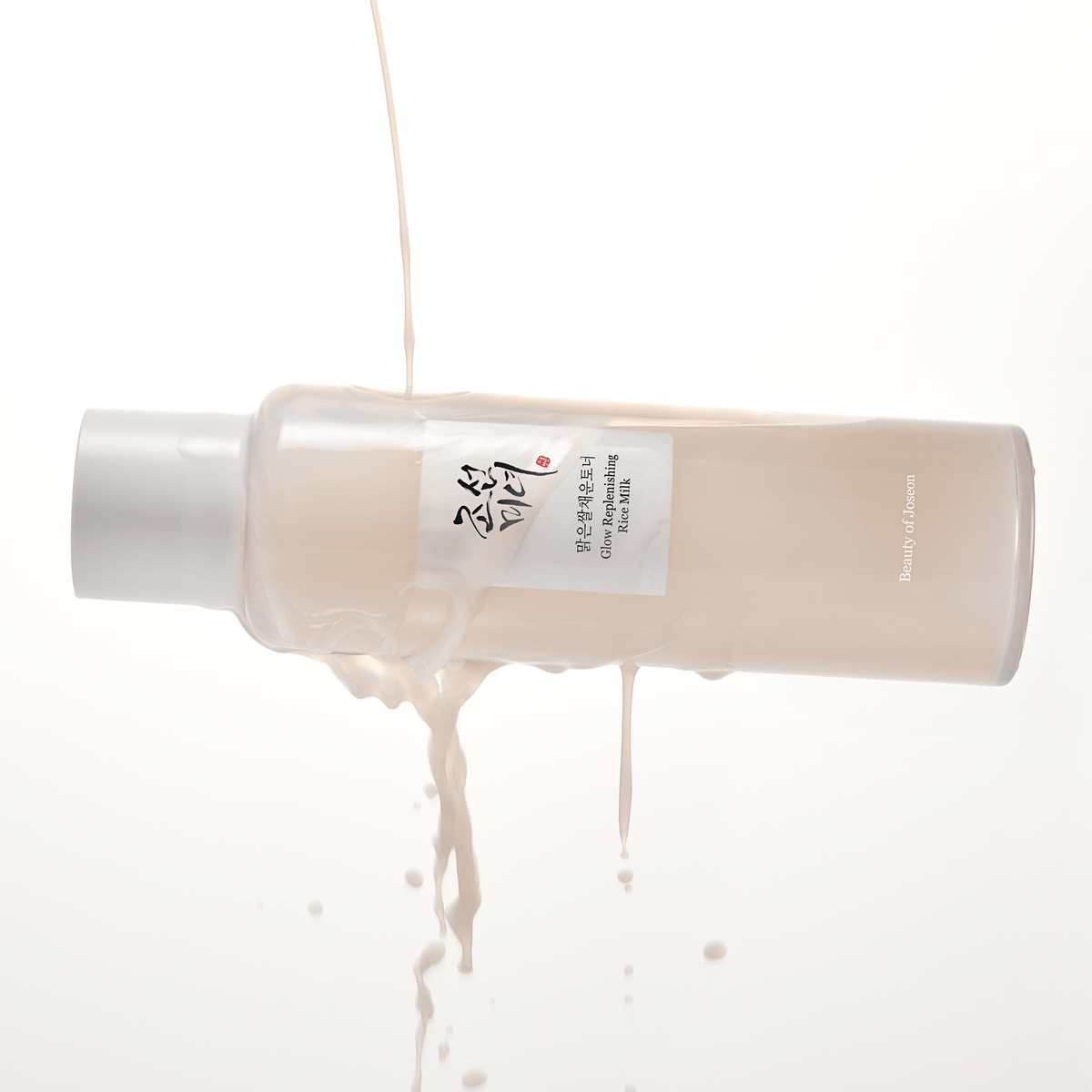 a bottle of liquid pouring out of it