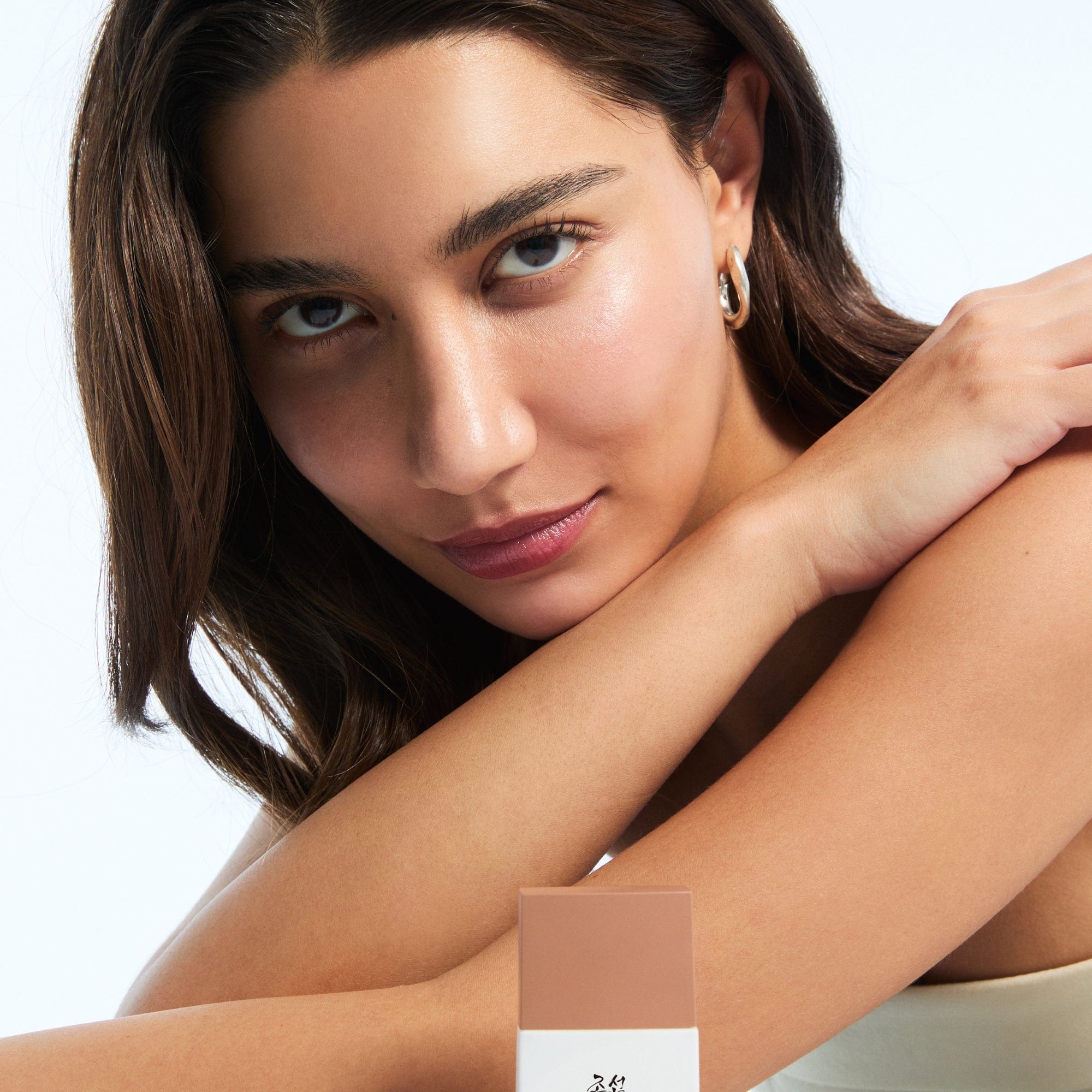 a woman with her arms crossed