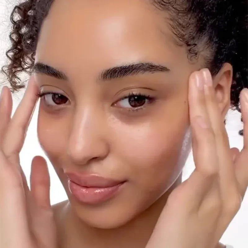 a woman touching her face