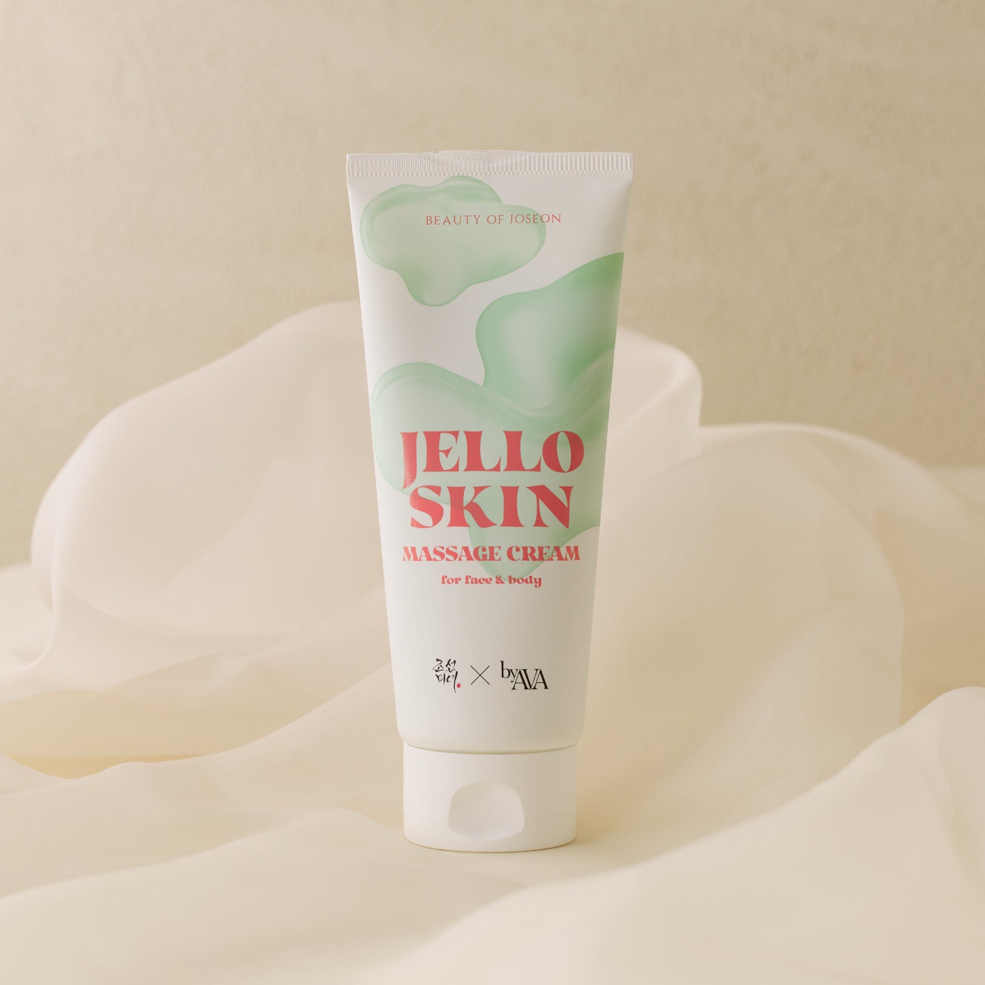 a white tube with green and pink text on it