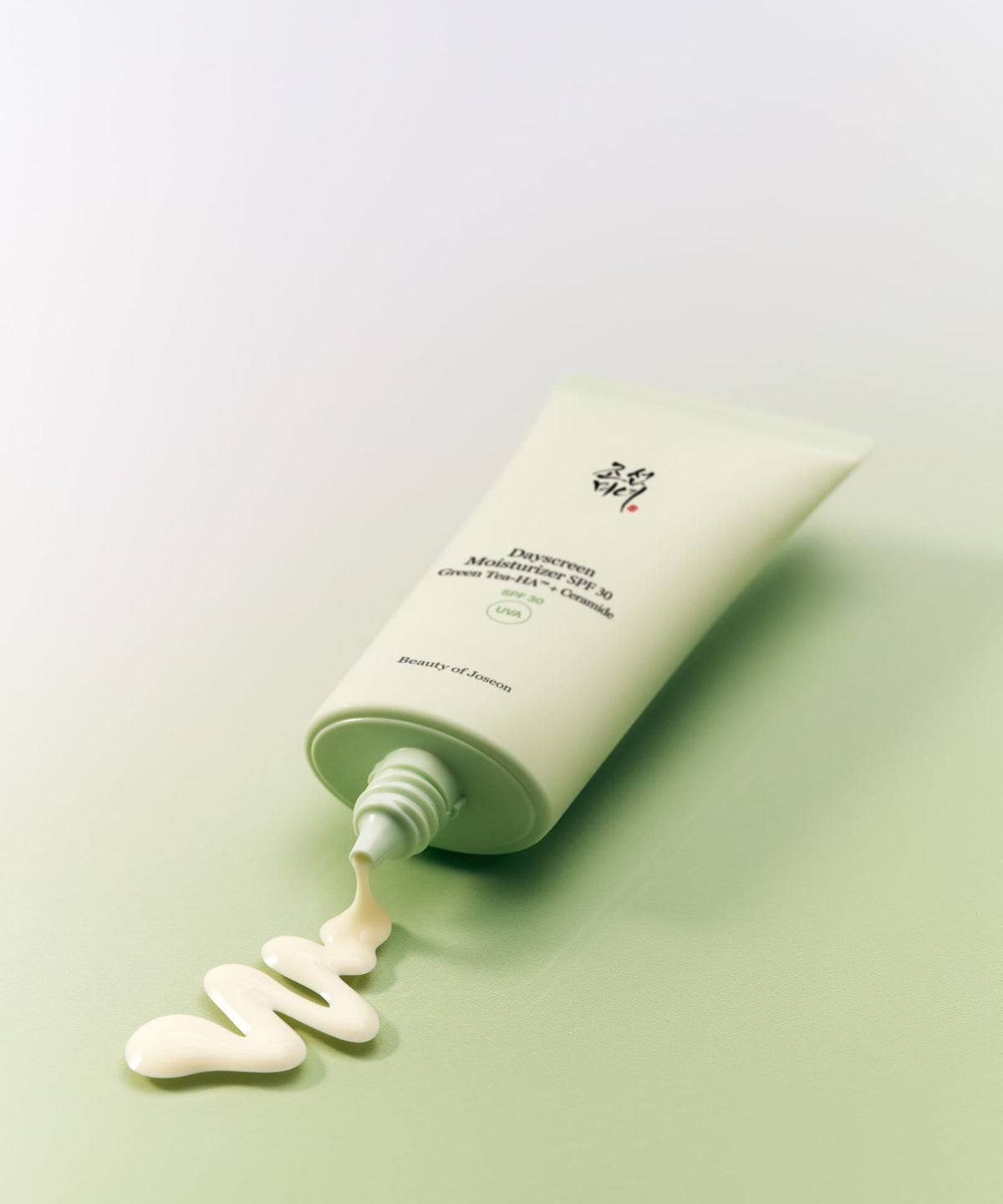 Skincare product with a light green background