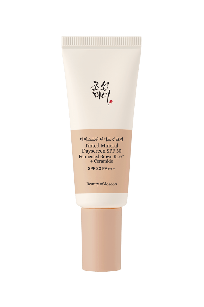 a cream bottle with black text