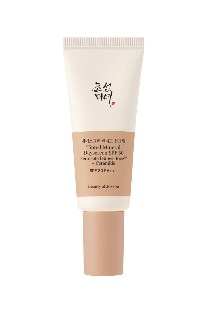 a white bottle with a brown lid