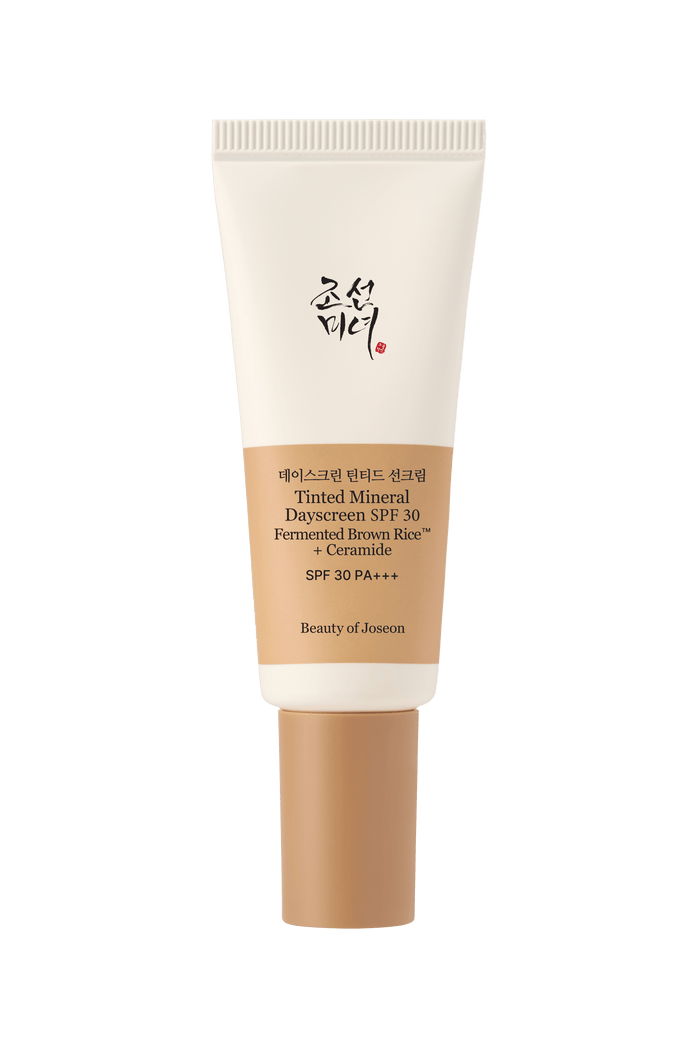 a cream bottle with a brown cap