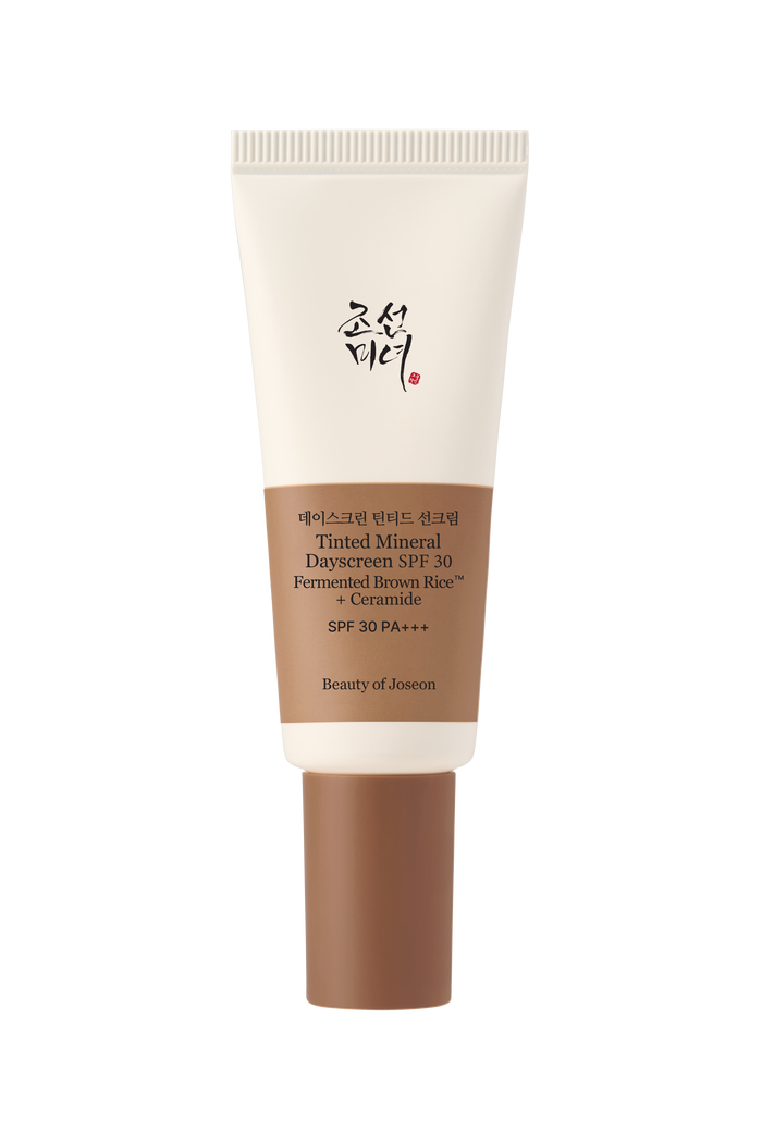 a white and brown tube of foundation