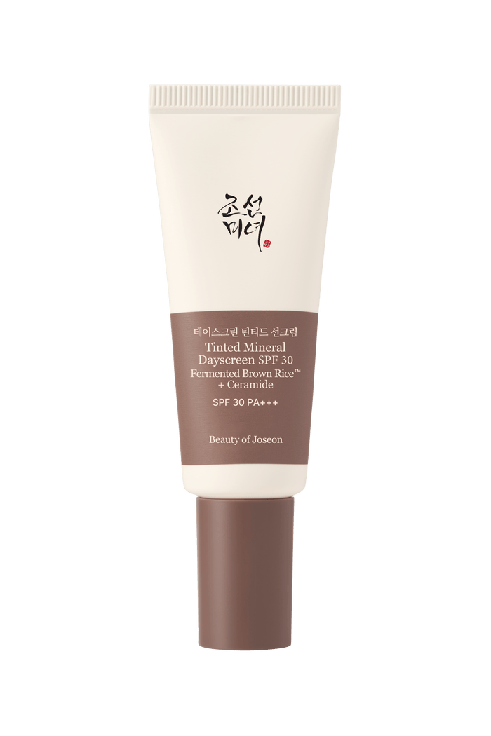 a white and brown tube with a brown label