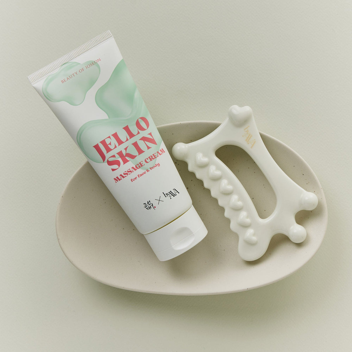 a white tube of gel and a white object on a white plate
