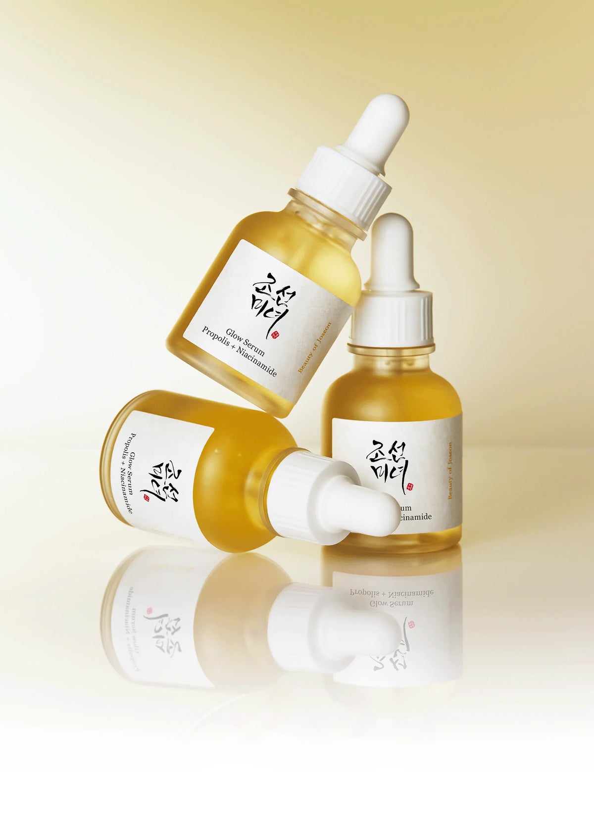 a group of bottles with yellow liquid