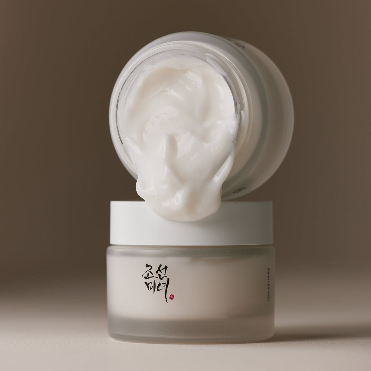 a white jar of cream
