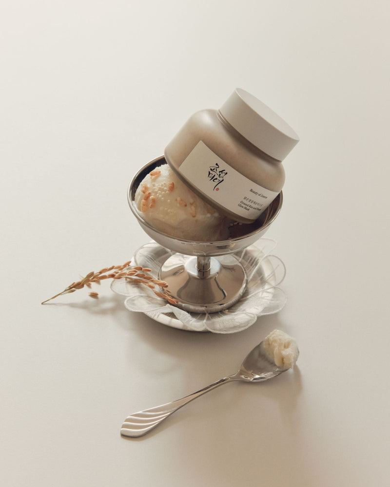 a bowl of ice cream with a spoon and a spoon