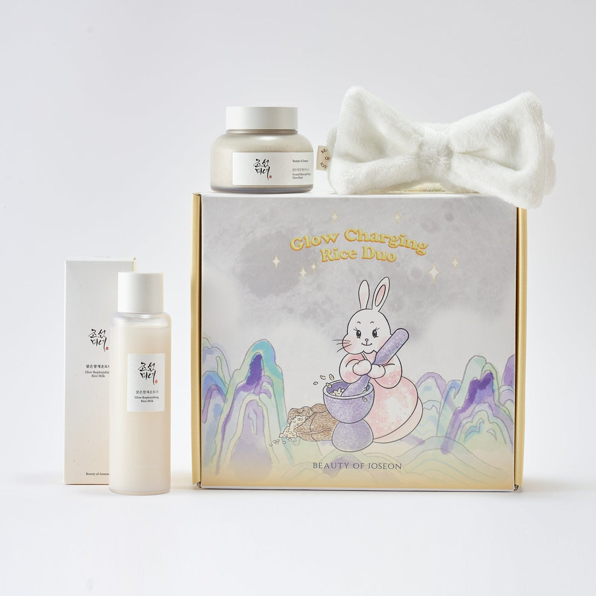 a box with a white bow tie and a white bottle with a cartoon rabbit on it