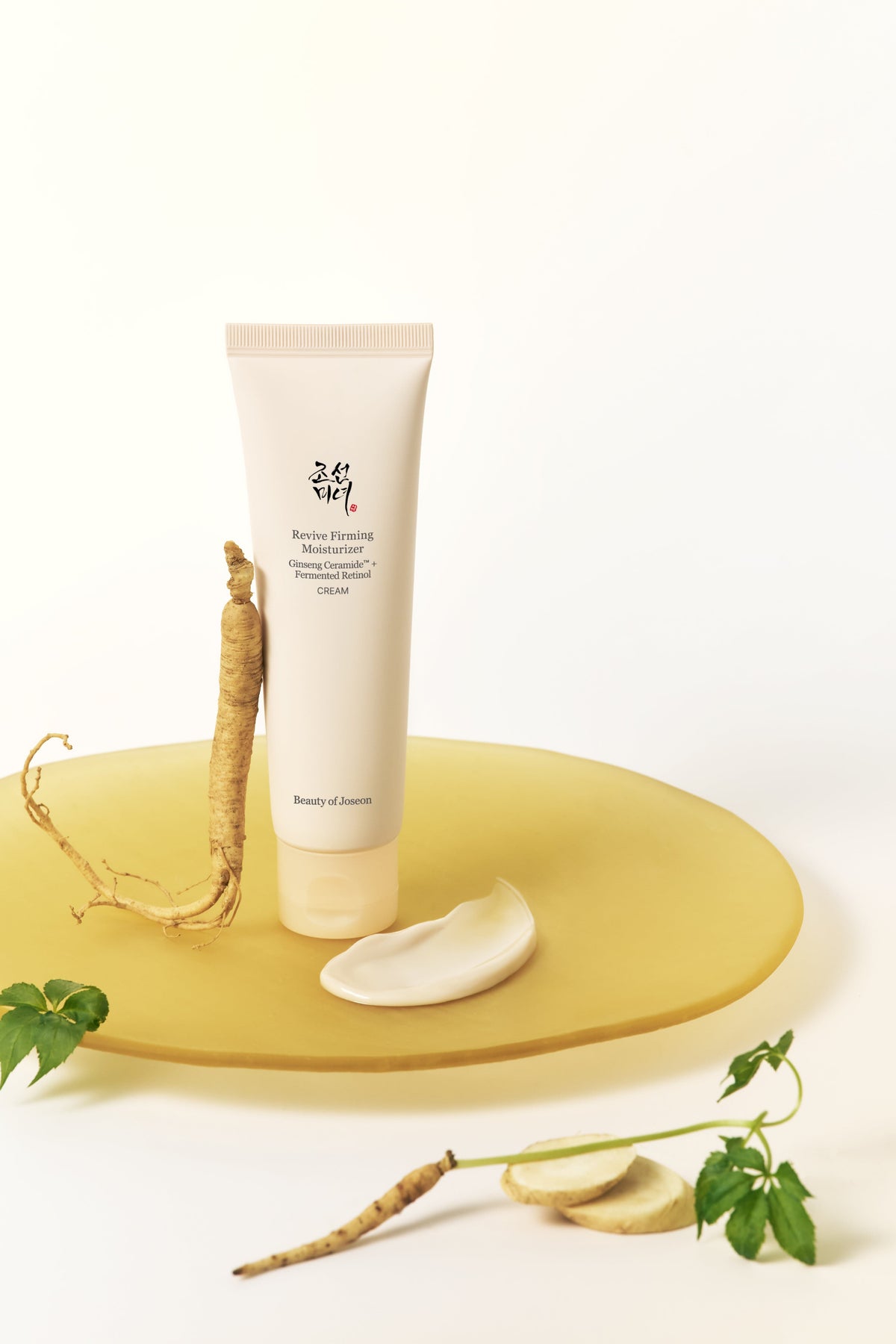 a tube of cream and root on a plate