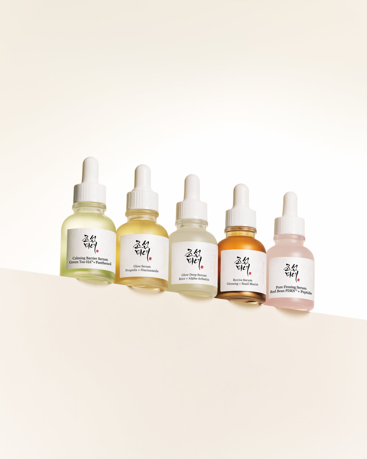 a group of bottles with white caps